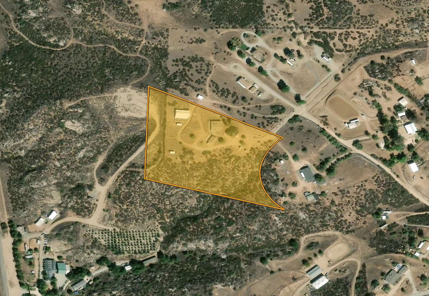 Parcel outline overlay for 39210 Grassy Rd showing the lot boundary on aerial imagery.